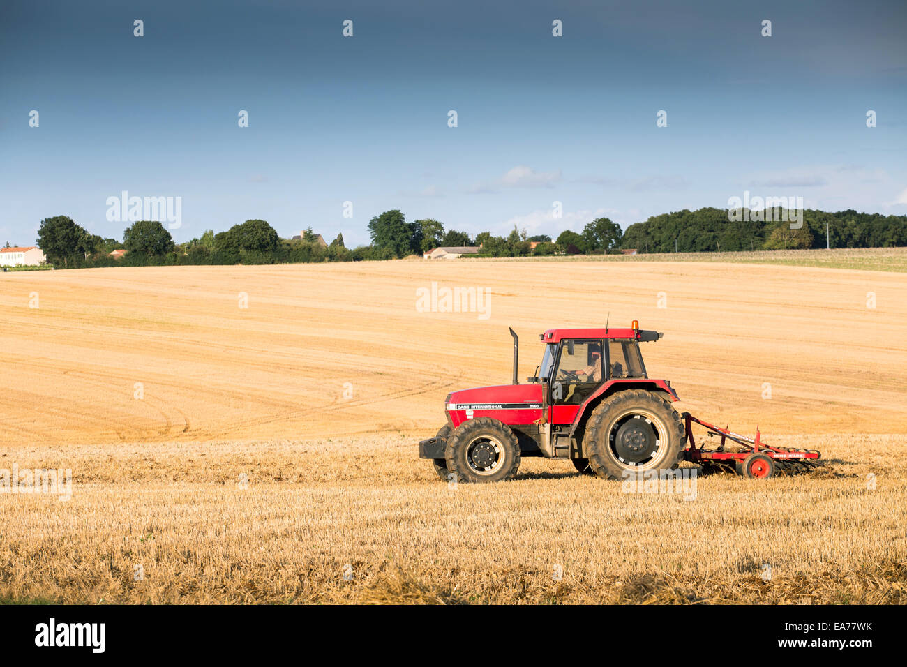 Tractor Harrowing A Field West Of Poitiers In South Western France 