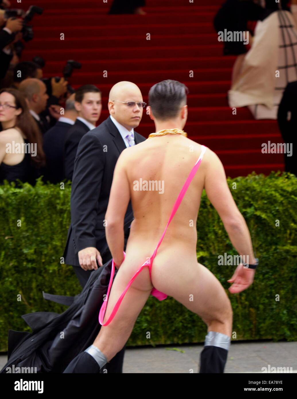 2014 Met Gala at the Metropolitan Museum of Art - Male streaker wearing a pink mankini and gold chain crashes the red carpet  Where: New York City, New York, United States When: 05 May 2014 Stock Photo