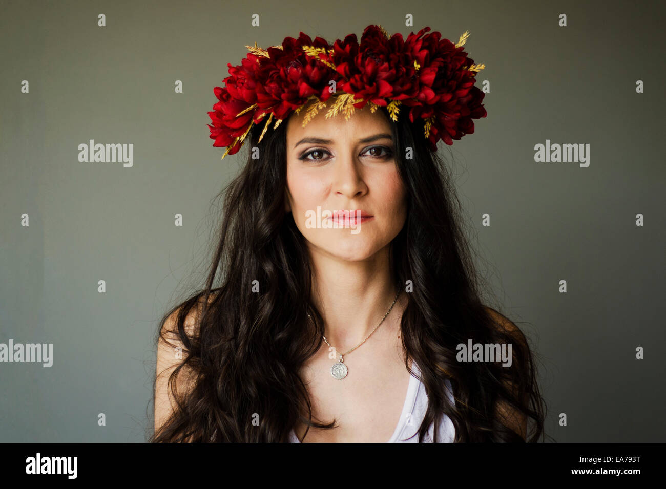 Studio portrait of brunette young adult woman wearing wreath Stock Photo