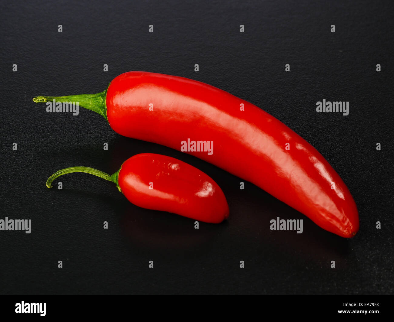 red yellow orange bell peppers on a wooden cutting board Stock Photo ...