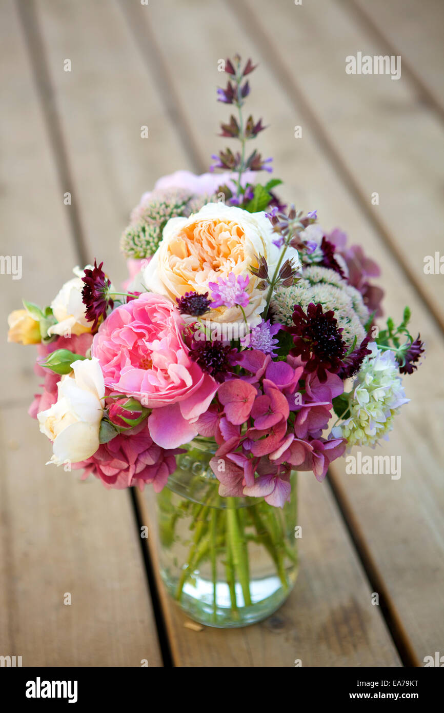 Bouquet or flowers on wooden table Stock Photo