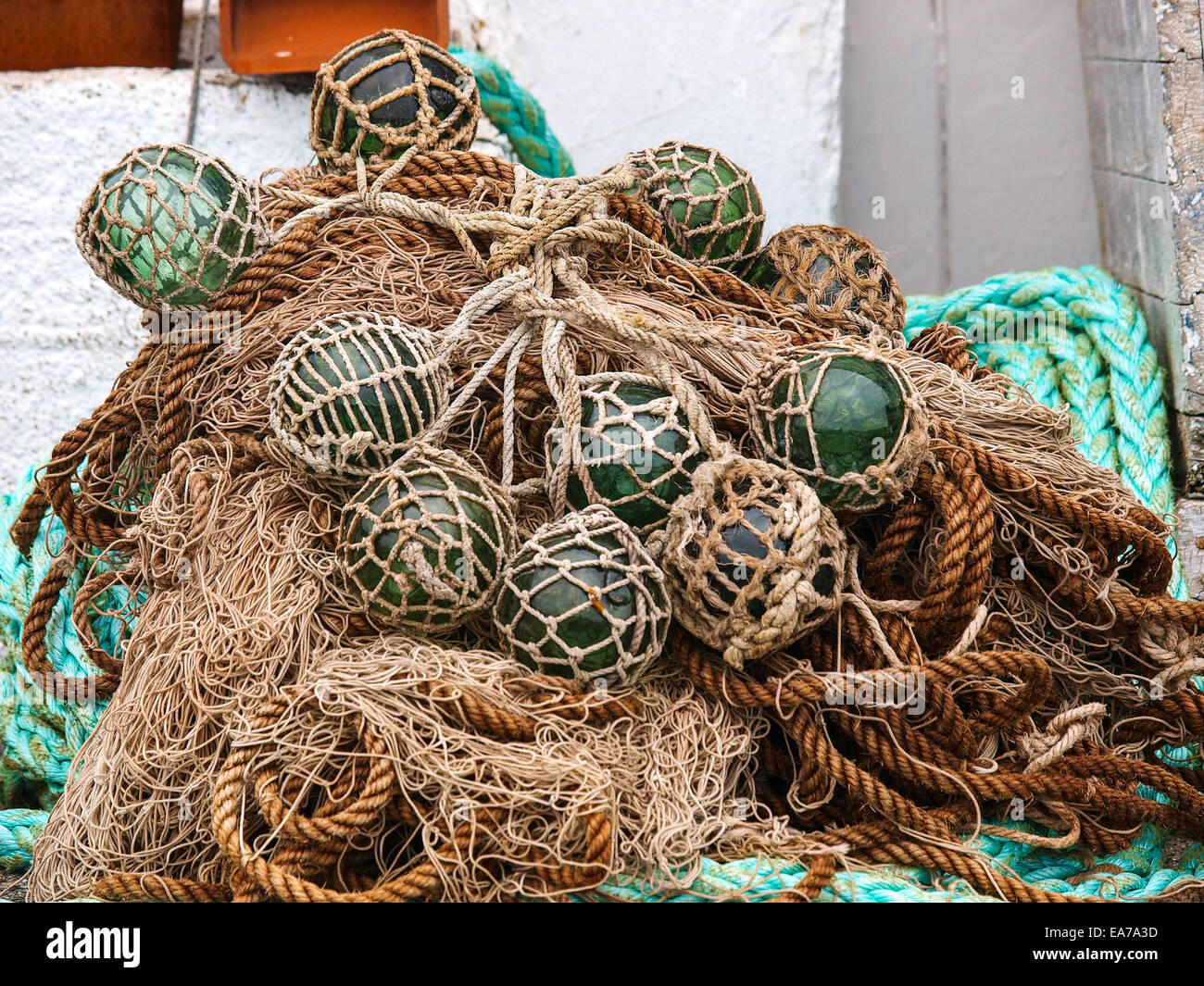 Closeup of old netted green glass float hanging on wall in Norway Stock  Photo - Alamy