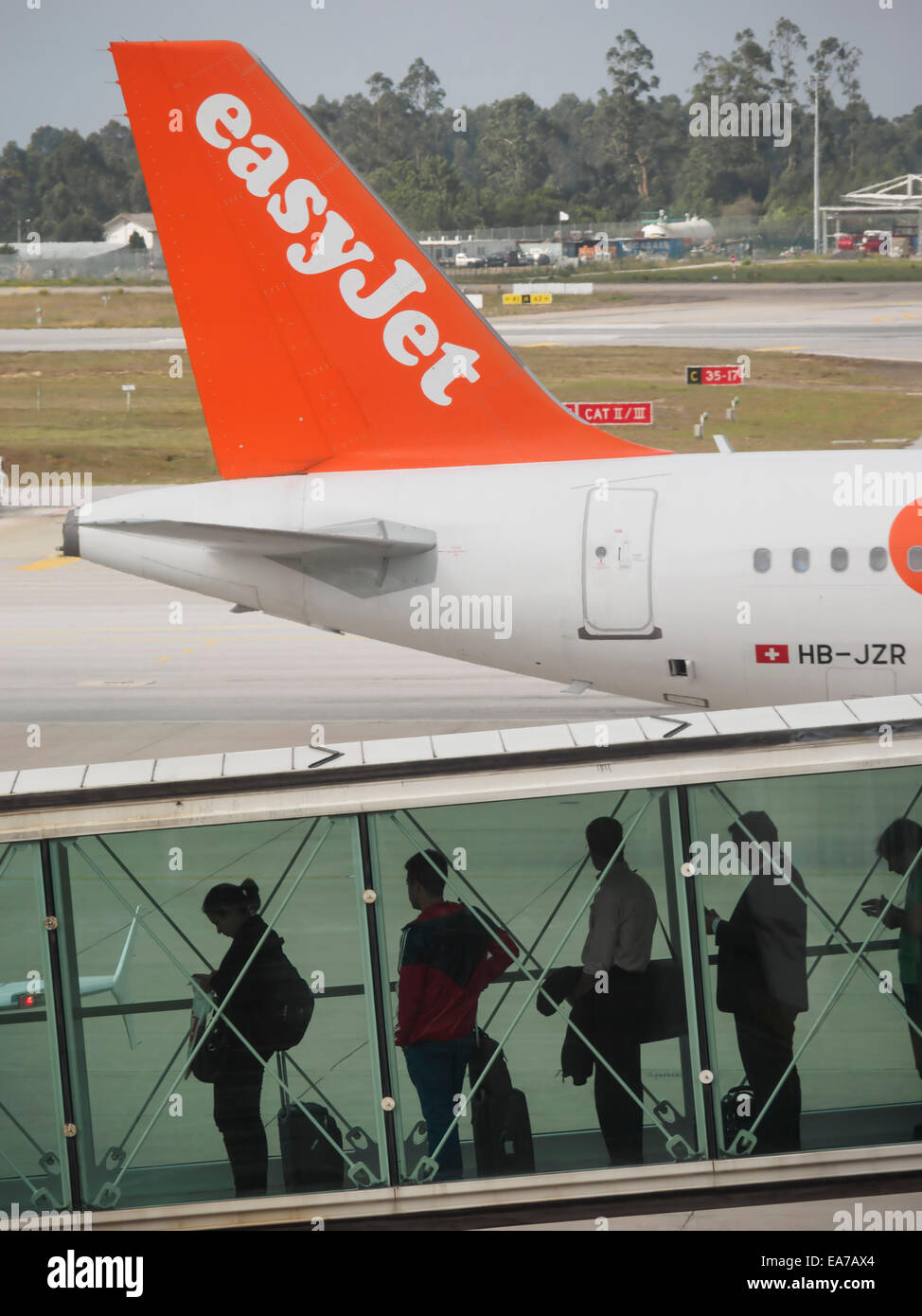 Passengers boarding next to easyJet airplane on an airport runway Stock Photo