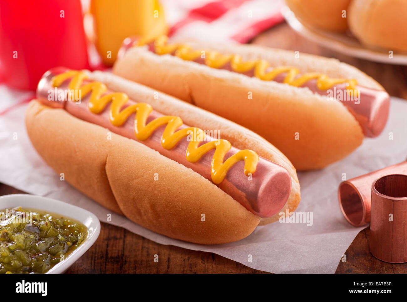 Food humour concept with hot dogs made with copper pipe. Stock Photo