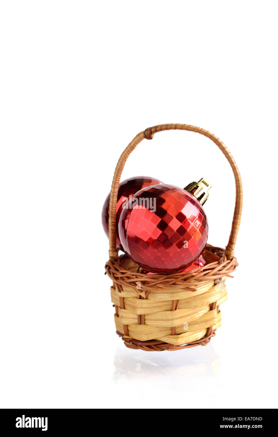 Red ball in basket Christmas decorations isolated on white Stock Photo