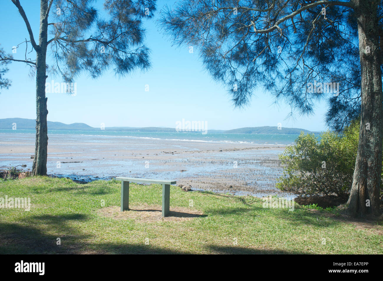 An empty bench overlooking the Port Stephens estuary in New South Wales, Australia Stock Photo