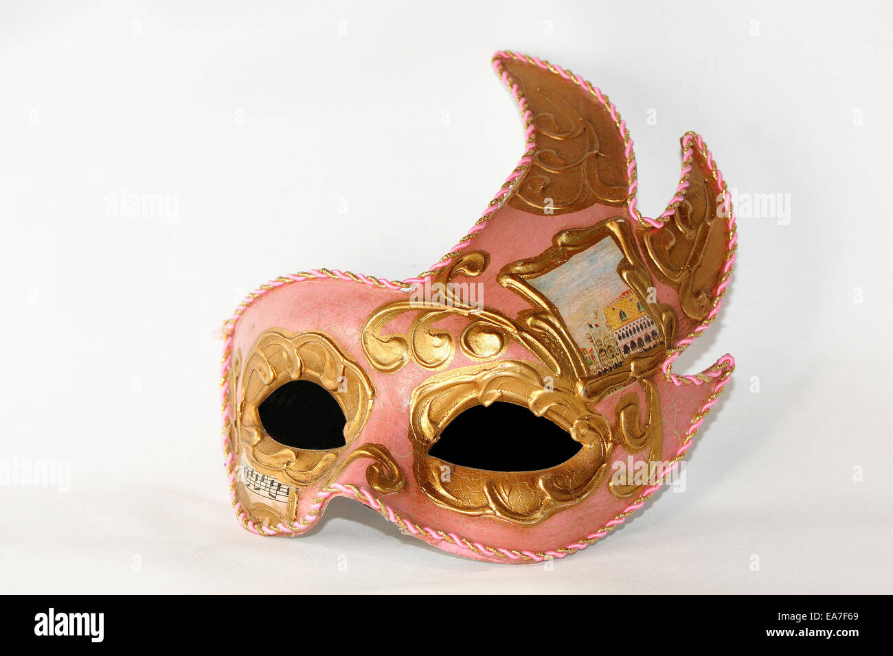 Pink and gold masquerade ball mask decoration Stock Photo
