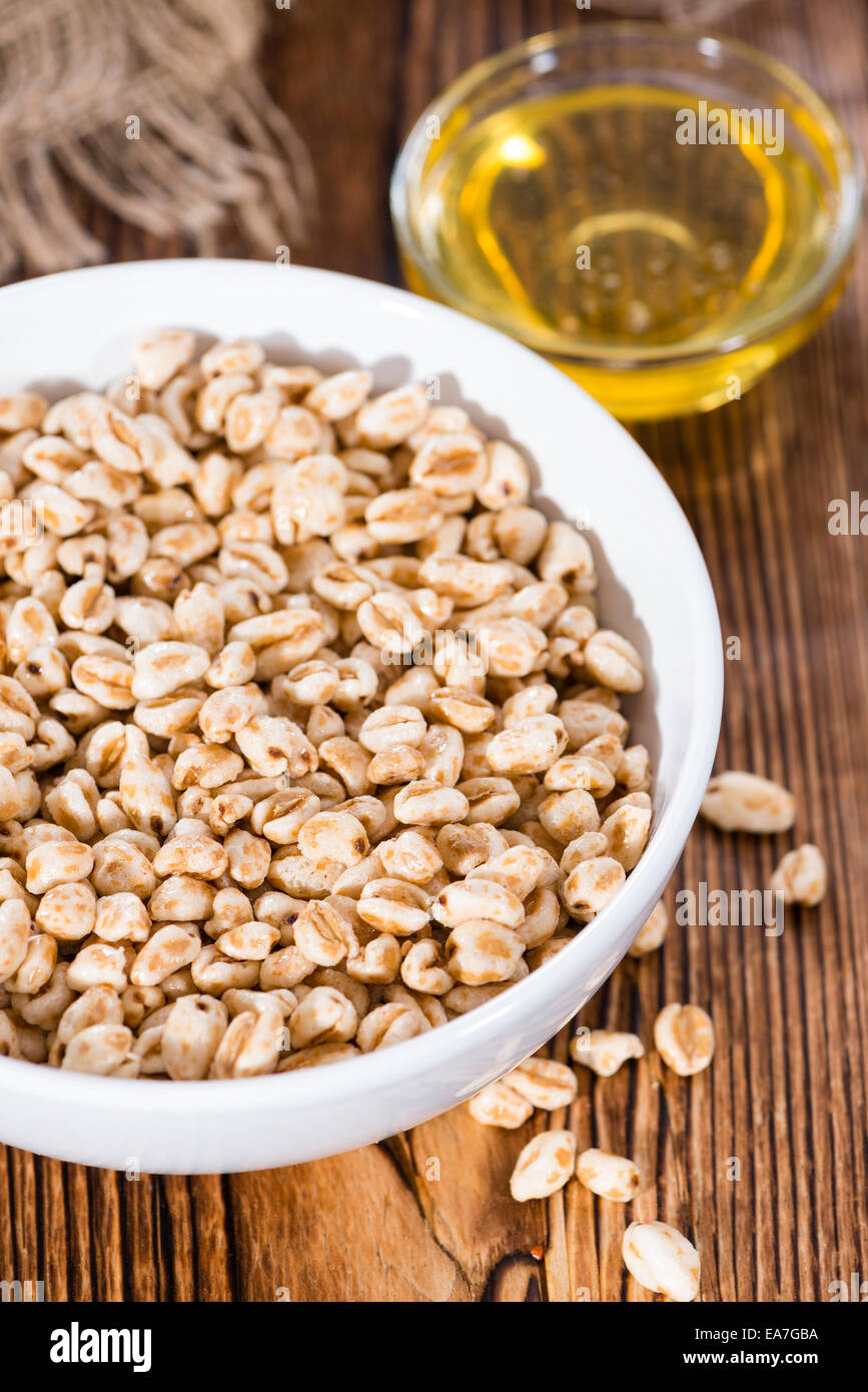 Portion of puffed wheat with milk and honey Stock Photo