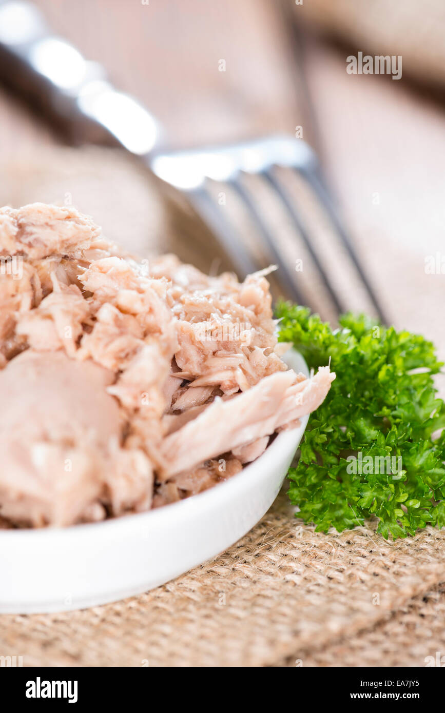 Portion of Tuna with fresh parsly on wooden background Stock Photo