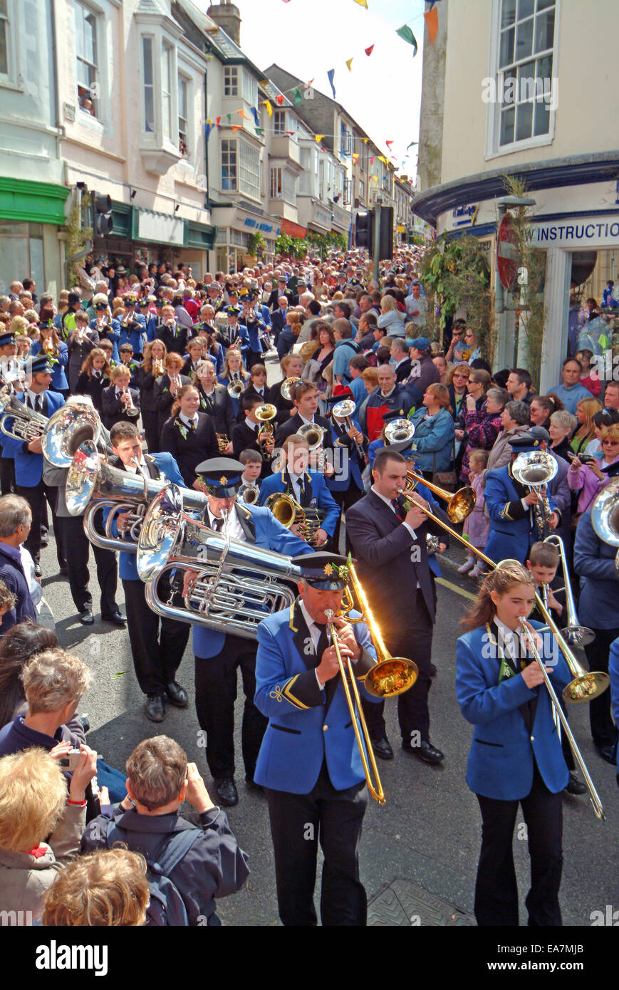The Principal Dance of The Day being led down Maneage Street to the Guildhall by The Helston Town Band on Flora Day in Helston K Stock Photo