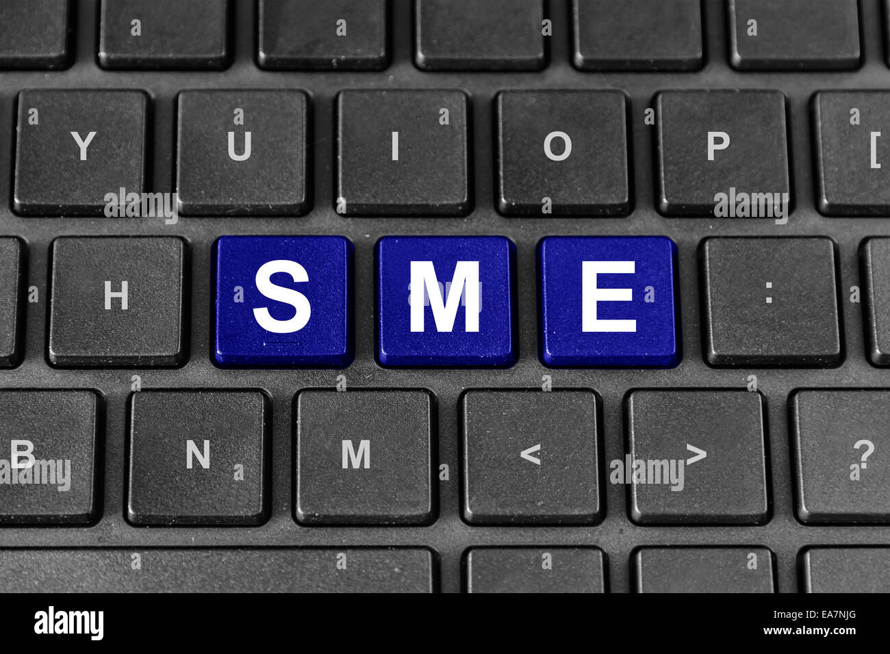SME or Small and medium-sized enterprises blue word on keyboard Stock Photo