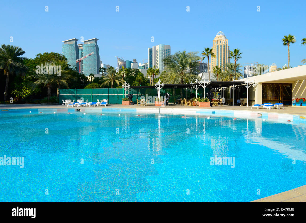Luxury hotel swimming pool in the middle of the commercial center of Doha, the capital of the Arabian Gulf country Qatar. Stock Photo
