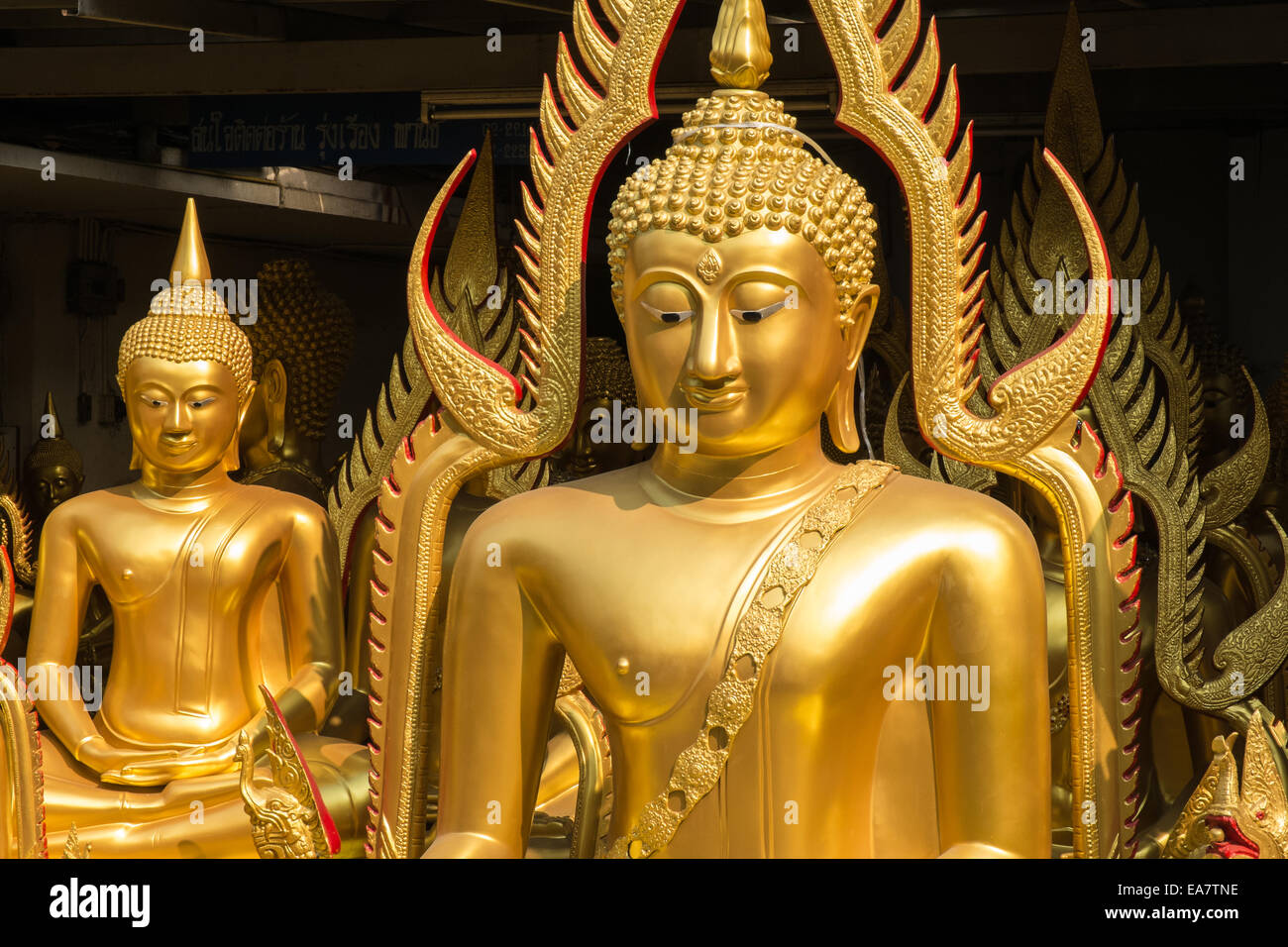 Buddhas at factory showroom in Chinatown area of Bangkok,Thailand Stock Photo