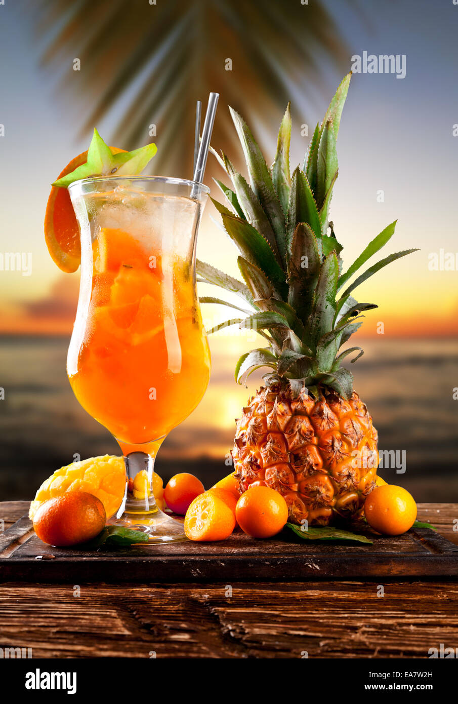 Fresh summer orange drink, blur beach on background Stock Photo