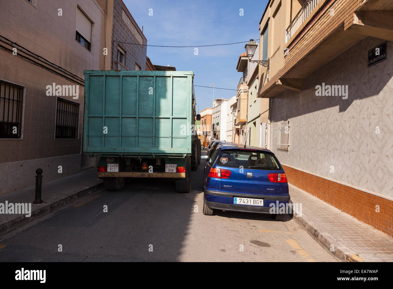 Trailer squeezing through the narrow streets of El Palmar, albufera, valencia, Spain. Stock Photo