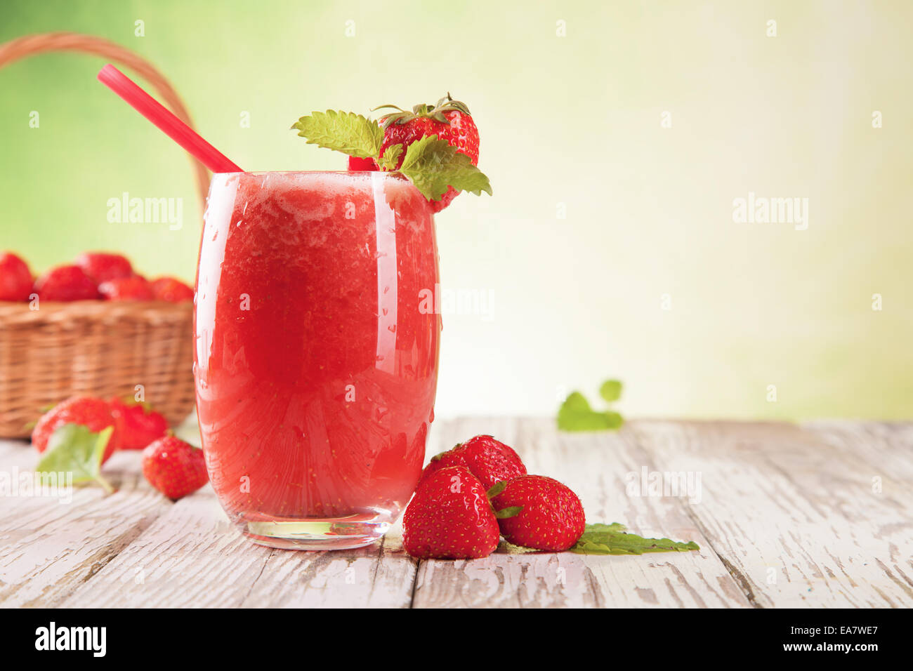 Fresh harvested strawberries mixed into drink Stock Photo