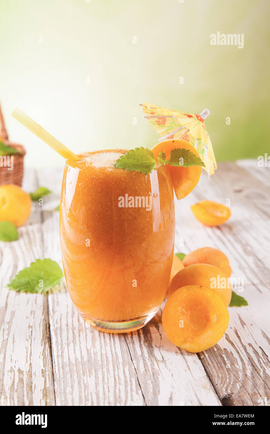 Fresh harvested apricots mixed into drink Stock Photo