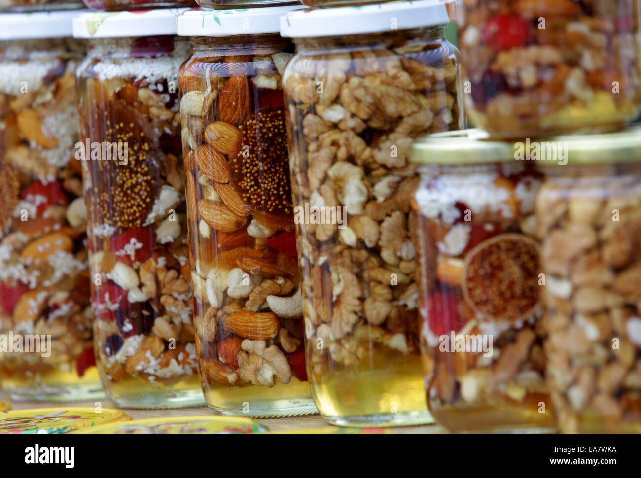 Honey with nuts and fruits Stock Photo Alamy