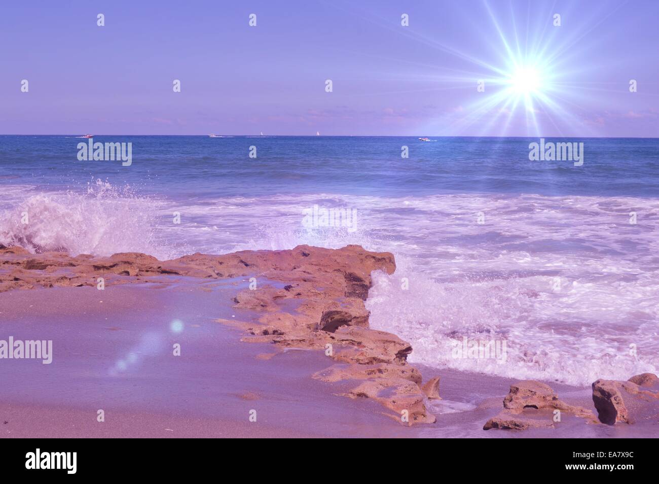 Star burst over rocky beach Stock Photo