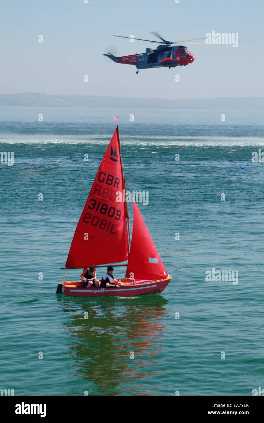 Sailing Dinghy Puff 31809 and Helicopter demonstration in Looe Bay just