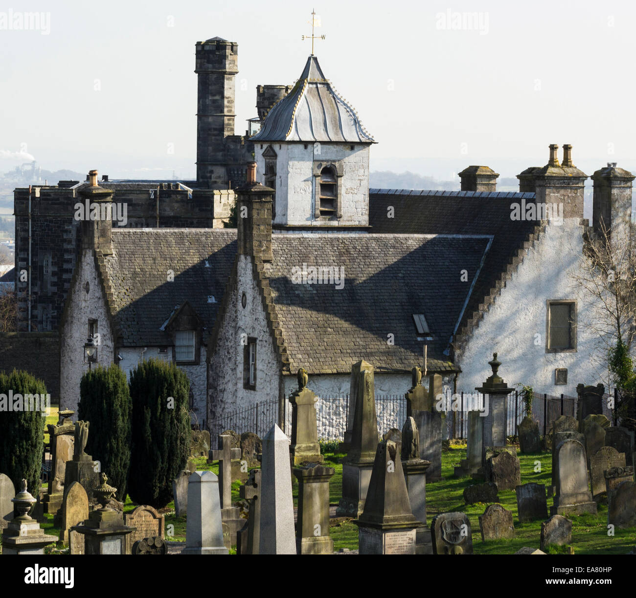 The beautiful historic Cowane's Hospital in Stirling, Scotland. Old graveyard in forefront and Stirling old jail in background. Stock Photo