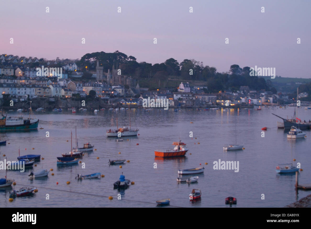 Dusk view from Polruan looking across the River Fowey to the town of Fowey Caradon South East Cornwall South West England UK Stock Photo