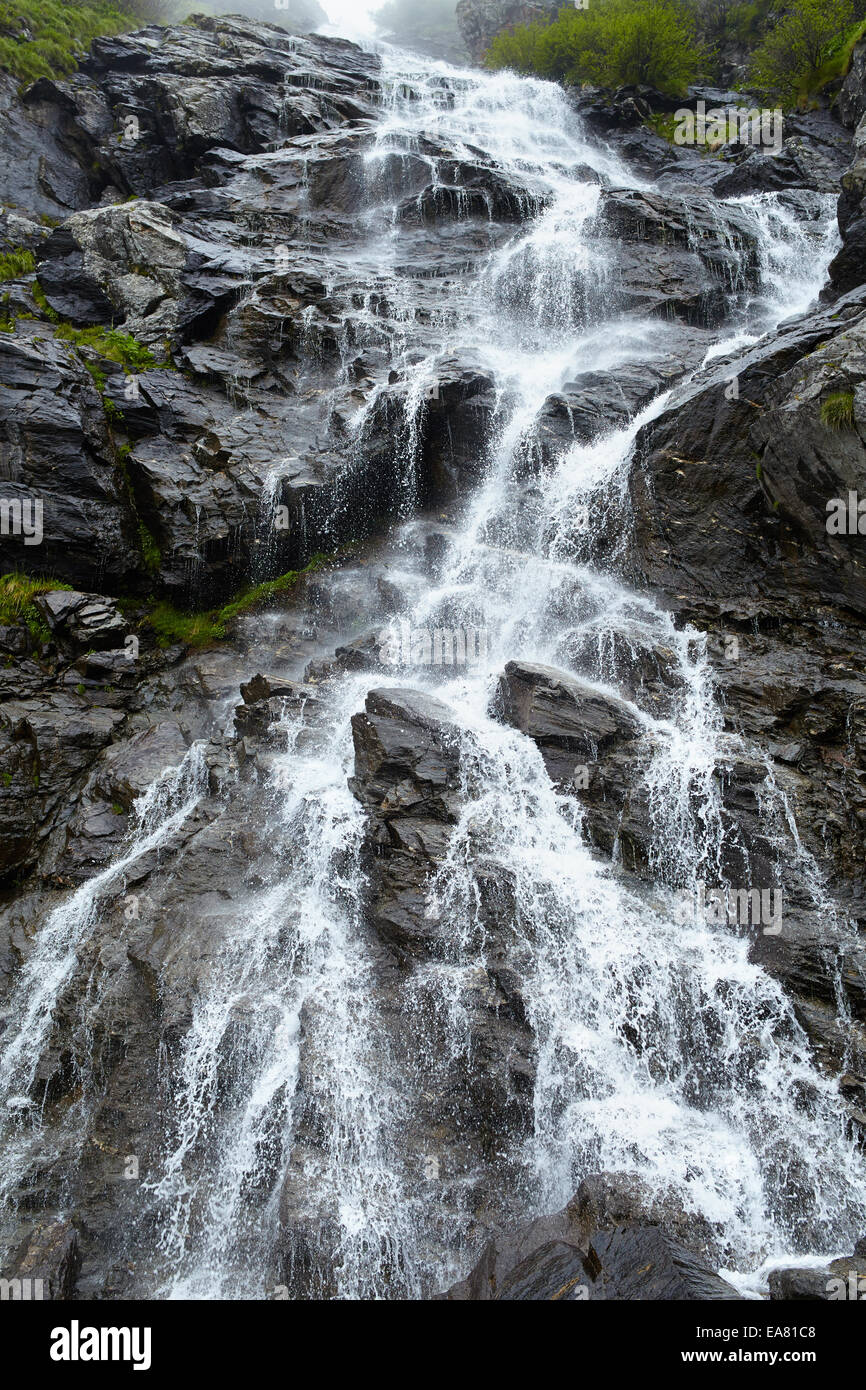 Landscape with a waterfall on a rocky mountain Stock Photo - Alamy
