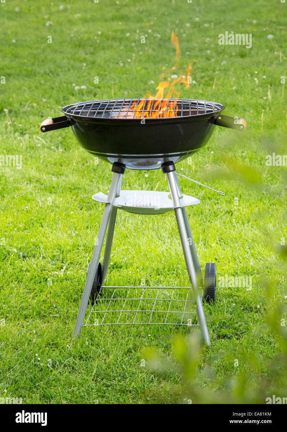 Empty grill on garden with burning embers Stock Photo