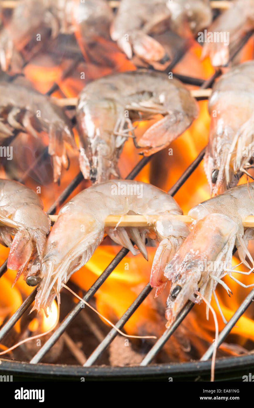 Delicious grilled prawns on burning coals Stock Photo