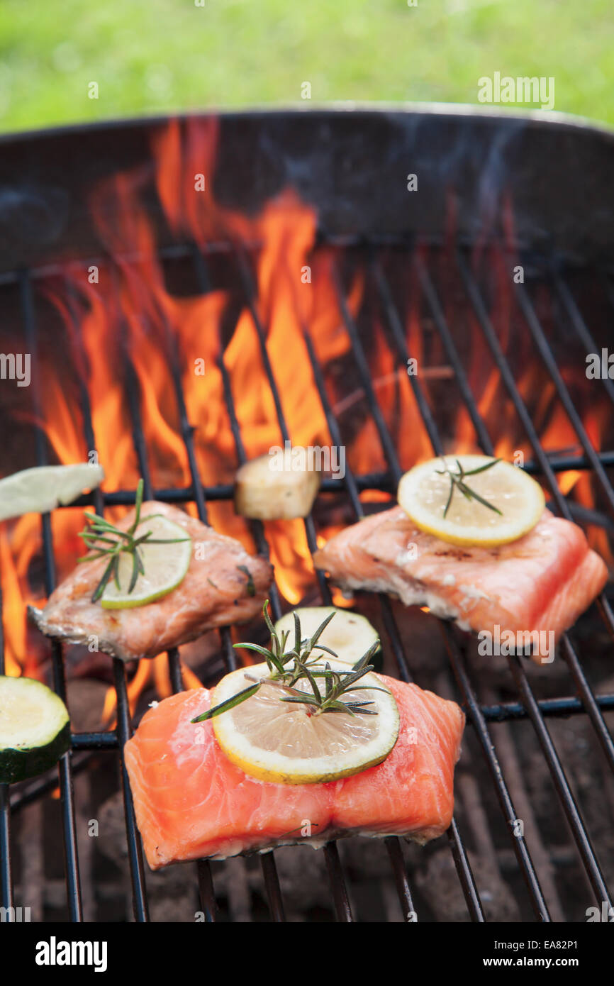 Grilled salmon steaks on fire Stock Photo