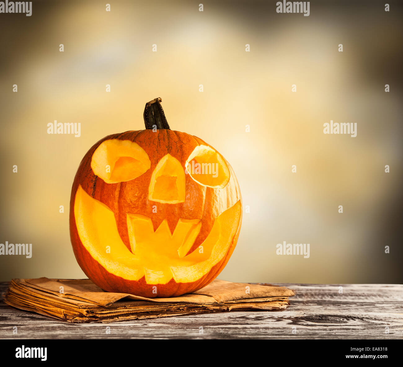 Evil halloween pumpkin on wood with free space for text Stock Photo