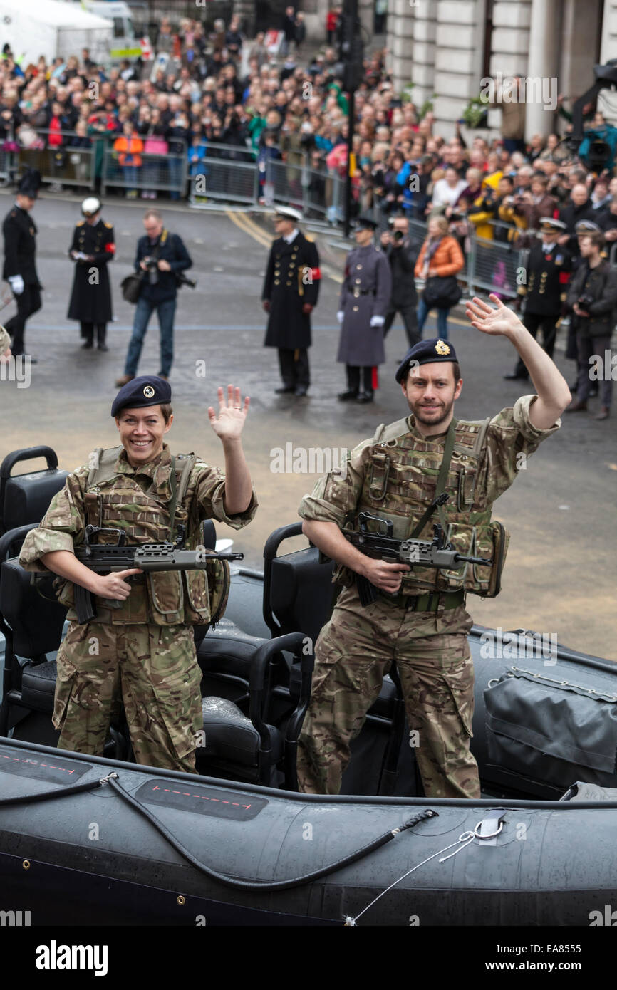 8th November 2014, Lord Mayor's Show, City of London, London, UK. Two soldiers of the Royal Marines wave at the public. The Lord Mayor's Show is the oldest civil procession in the world, it celebrates the start of a one-year term for the new Mayor of the City of London. Stock Photo