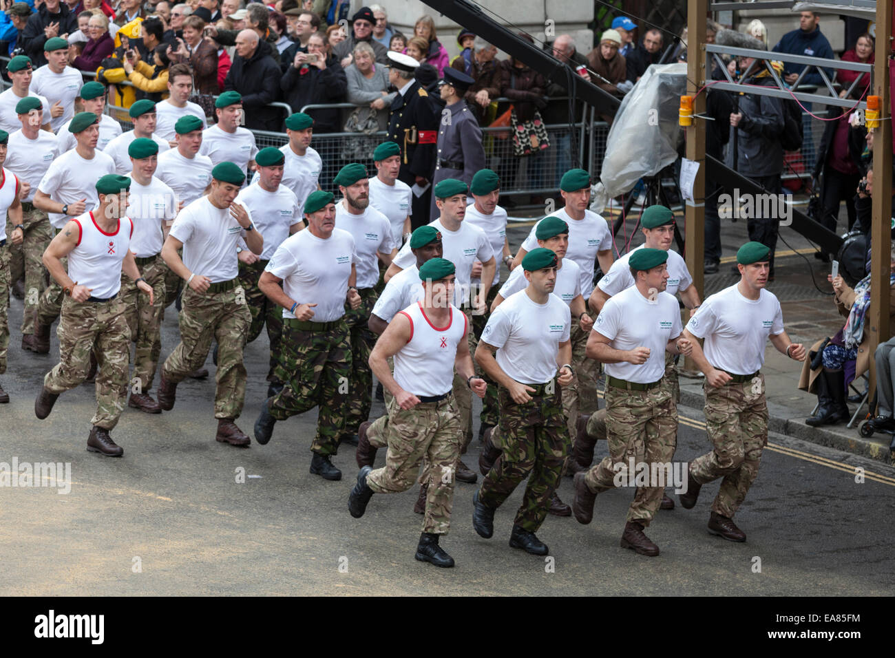 8th November 2014, Lord Mayor's Show, City of London, London, UK. Members of Commando 999, a charity to raise funds for the Royal Marines, speed marching along the route at Mansion House. The Lord Mayor's Show is the oldest civil procession in the world, it celebrates the start of a one-year term for the new Mayor of the City of London. Stock Photo