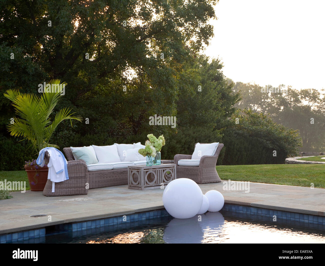 outdoor seating area at swimming pool Stock Photo