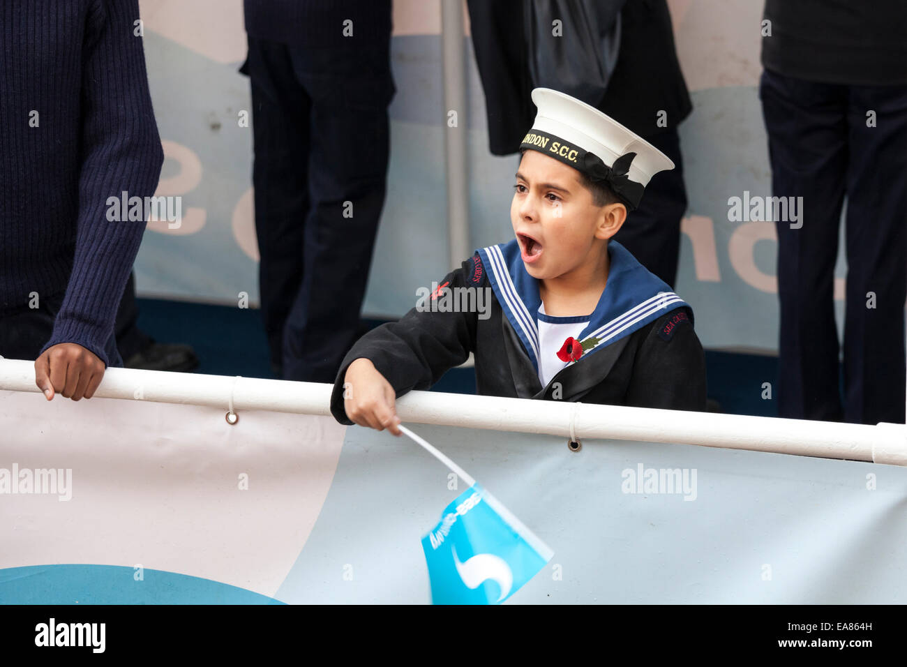 8th November 2014, Lord Mayor's Show, City of London, London, UK. A young member of the London Area Sea Cadets Corps cheers on the public during the procession. The Lord Mayor's Show is the oldest civil procession in the world, it celebrates the start of a one-year term for the new Mayor of the City of London. Stock Photo