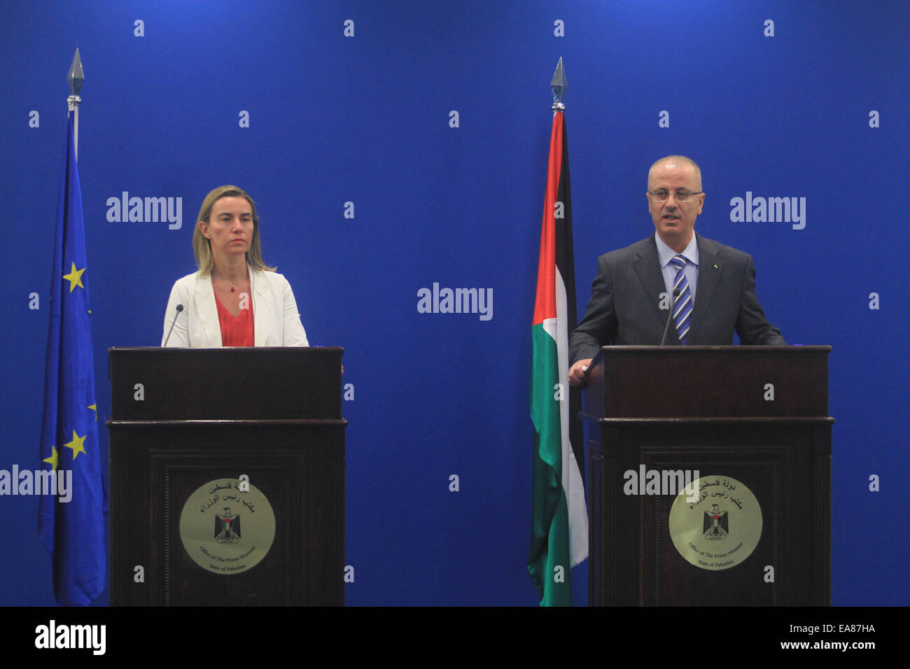 Ramallah. 8th Nov, 2014. Palestinian National Authority Prime Minister Rami Hamdallah (R) speaks during a joint press conference with European Union (EU) foreign policy chief Federica Mogherini in the West Bank City of Ramallah, on Nov. 8, 2014. Federica Mogherini visited the Gaza Strip on Saturday, and called for an immediate start of the reconstruction in the coastal enclave. Credit:  Fadi Arouri/Xinhua/Alamy Live News Stock Photo