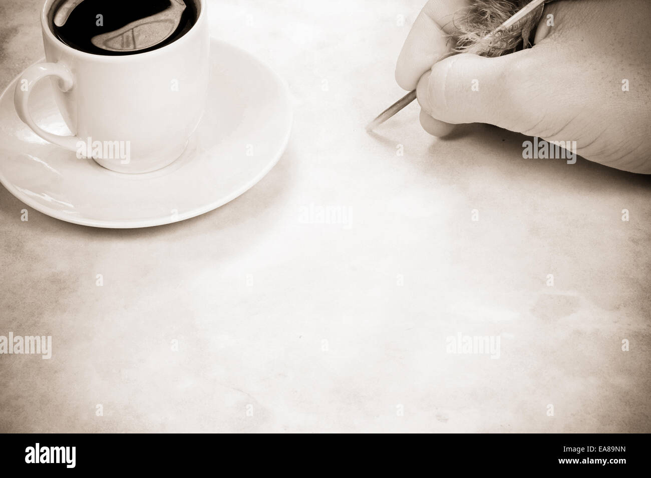coffee and writing hand on sepia Stock Photo
