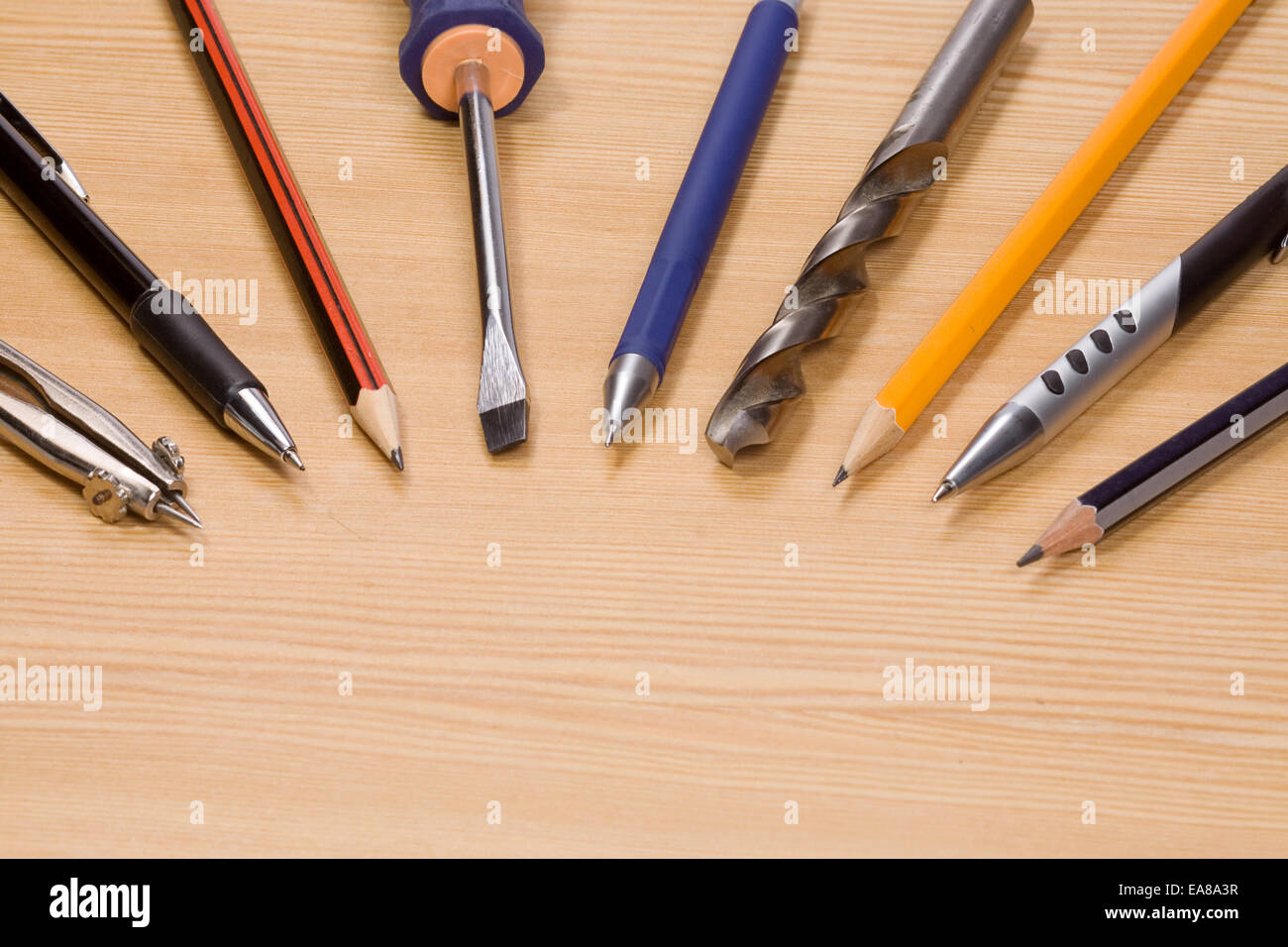 tools and pens at wood table Stock Photo