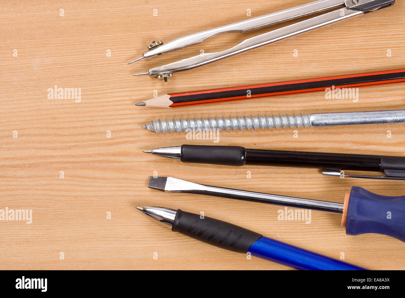 pens and tools on wood table Stock Photo