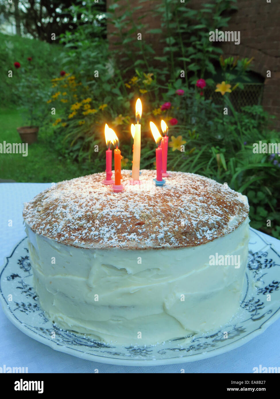 A Homemade Birthday Cake In A Back Yard In Late Afternoon Stock Photo
