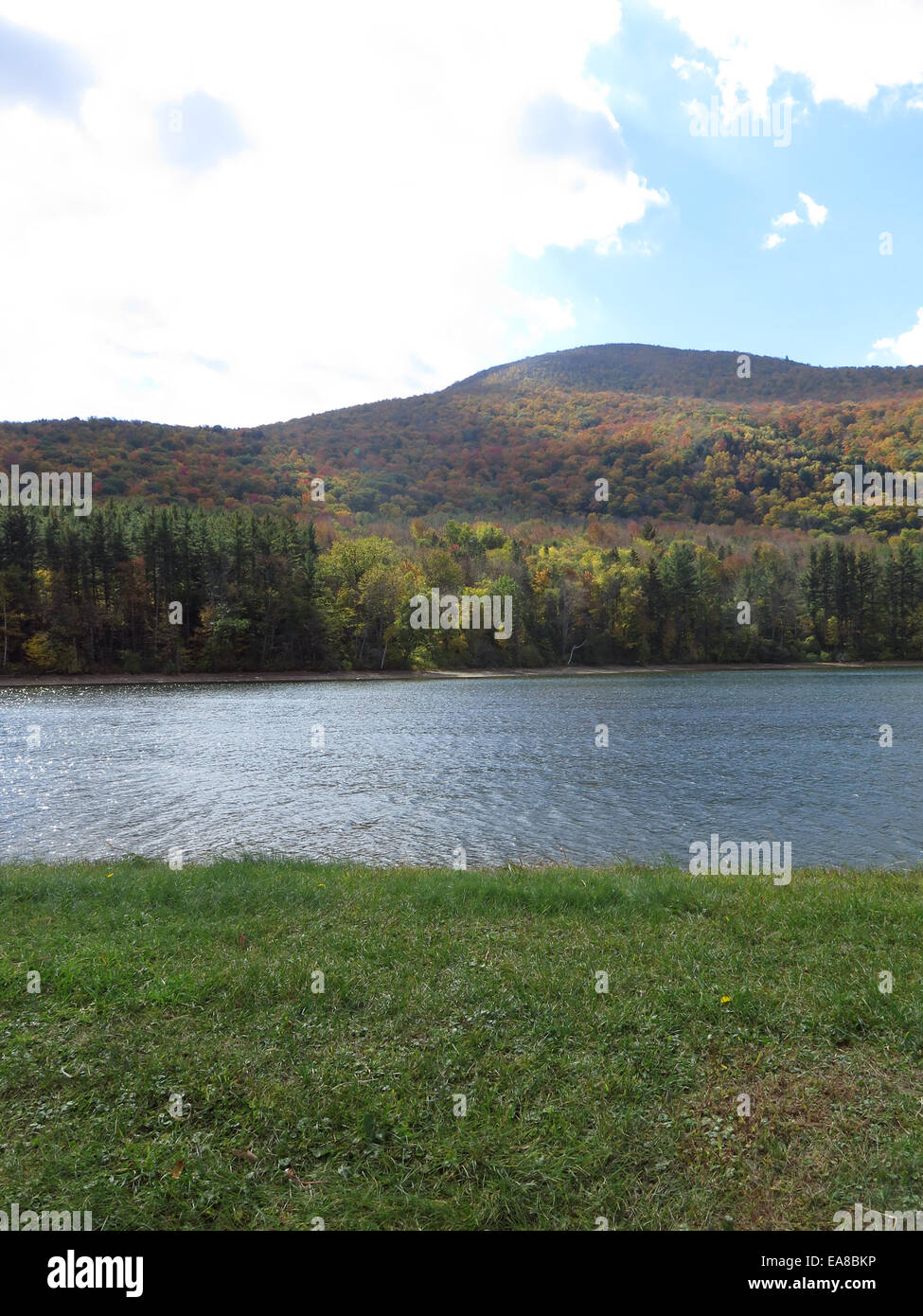 The public drinking water reservoir for the city of North Adams has a beautiful view of Mount Greylock in the fall. Stock Photo