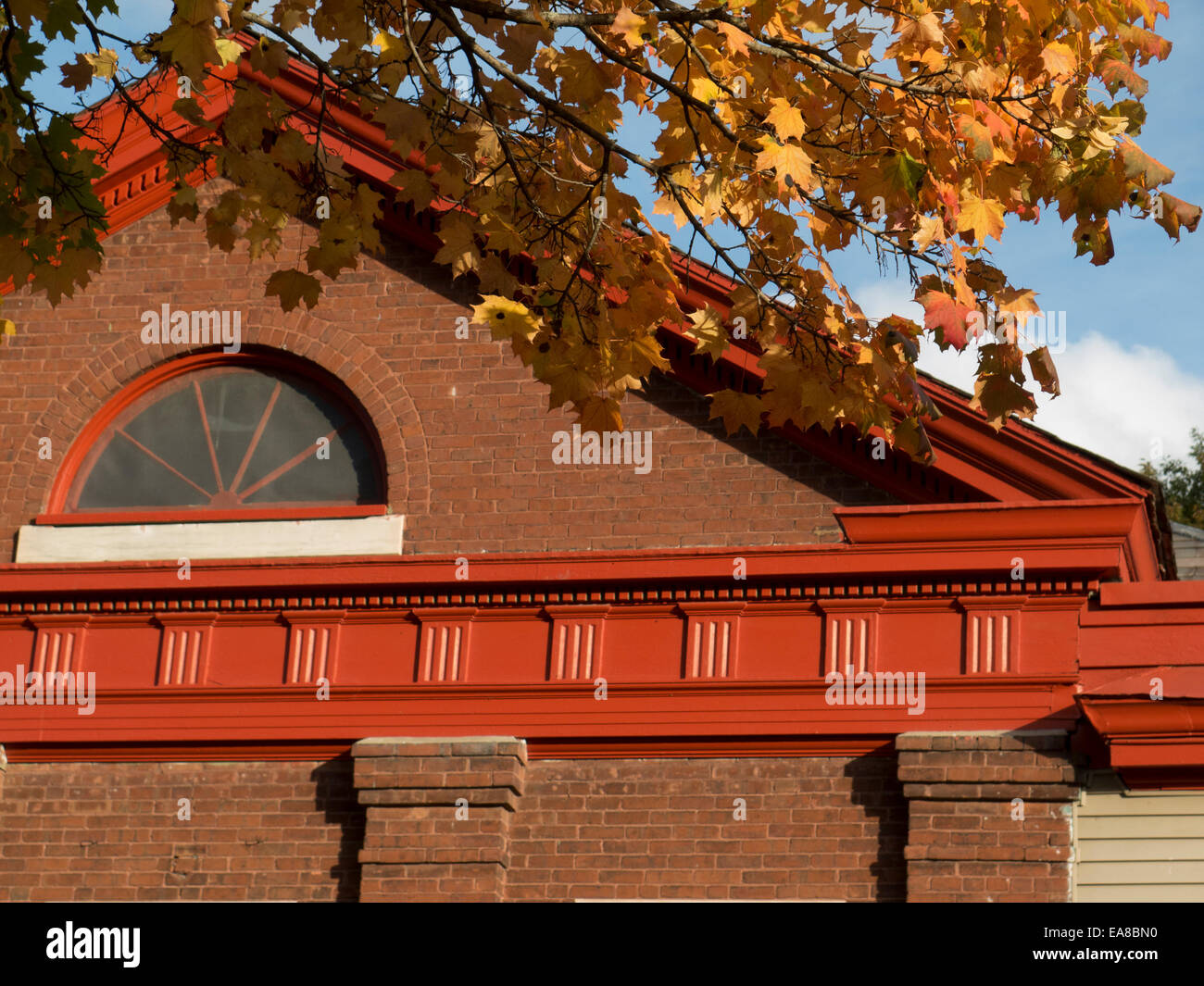 Architectural features are displayed on a brick former schoolhouse in Adams, MA.  It is residential and business property now. Stock Photo