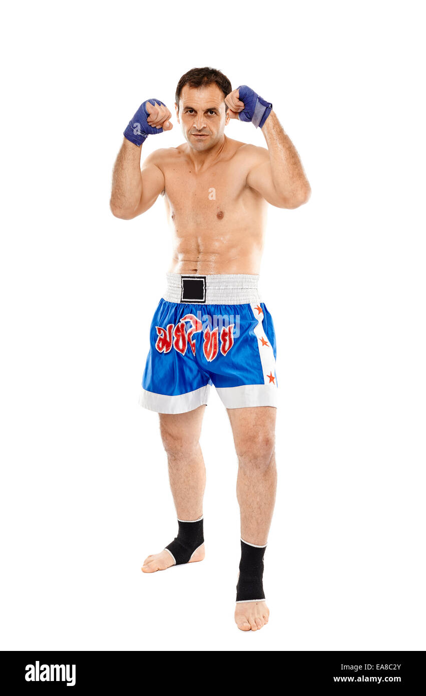 Kickbox or muay thai fighter in guard stance isolated on white