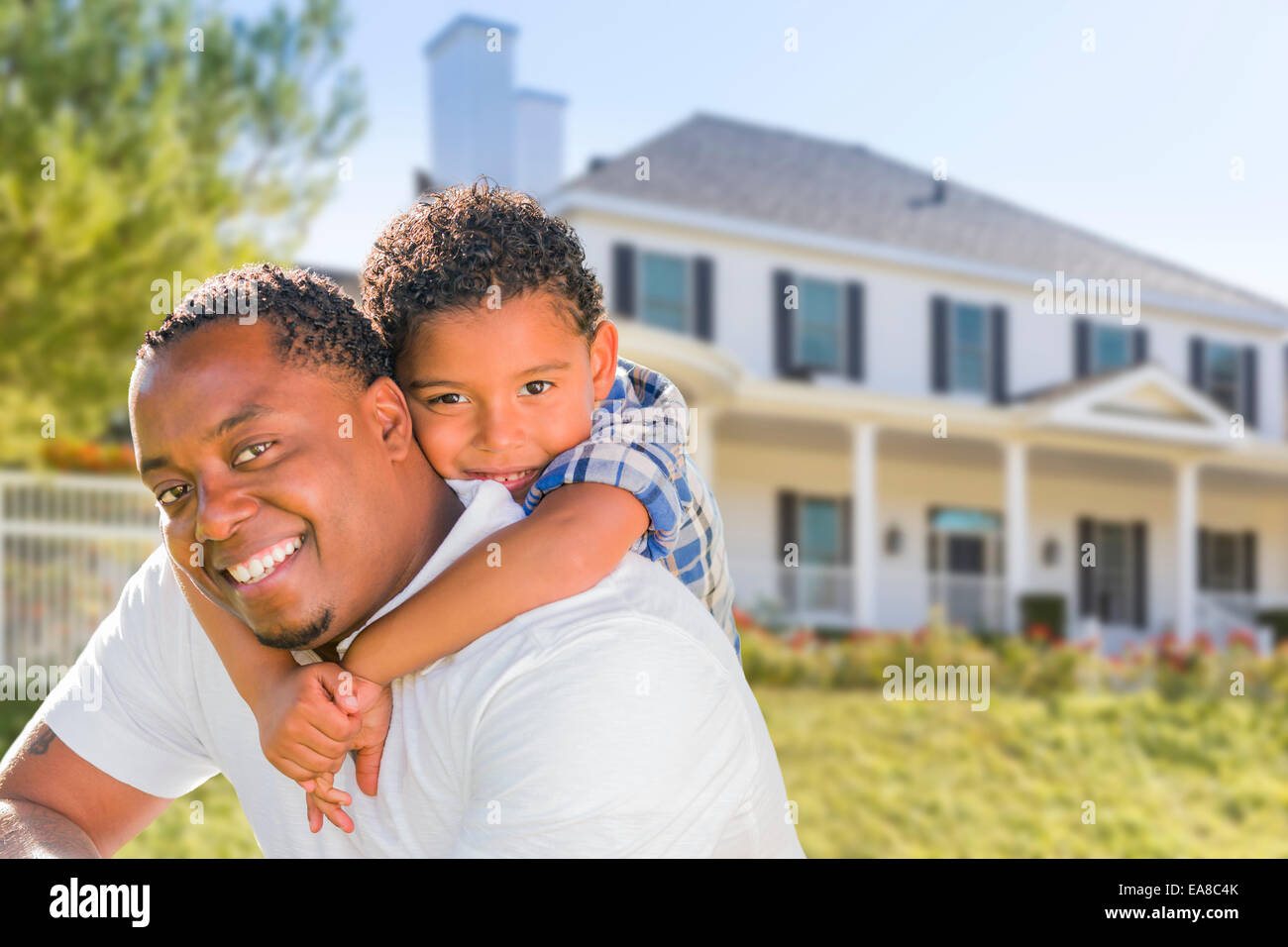 Happy Playful African American Father and Mixed Race Son In Front of ...