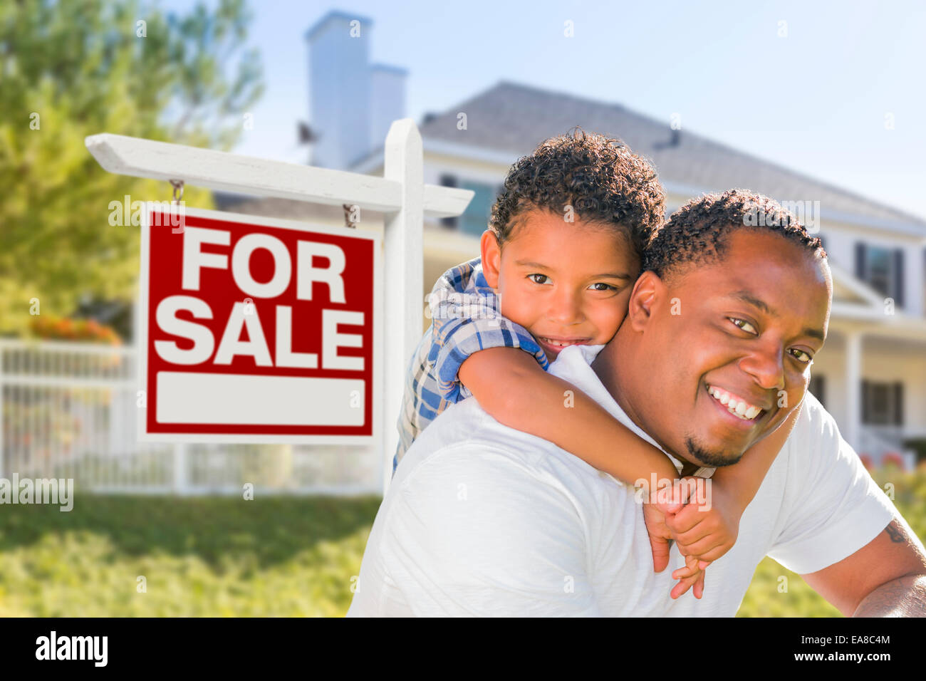 African American Father and Mixed Race Son In Front of Home For Sale ...
