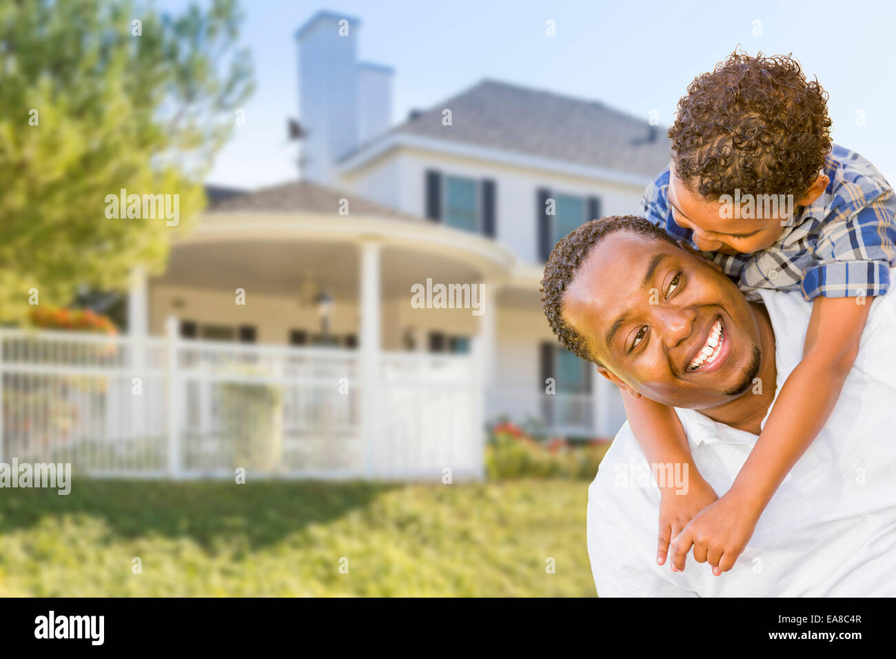 Happy Playful African American Father and Mixed Race Son In Front of ...