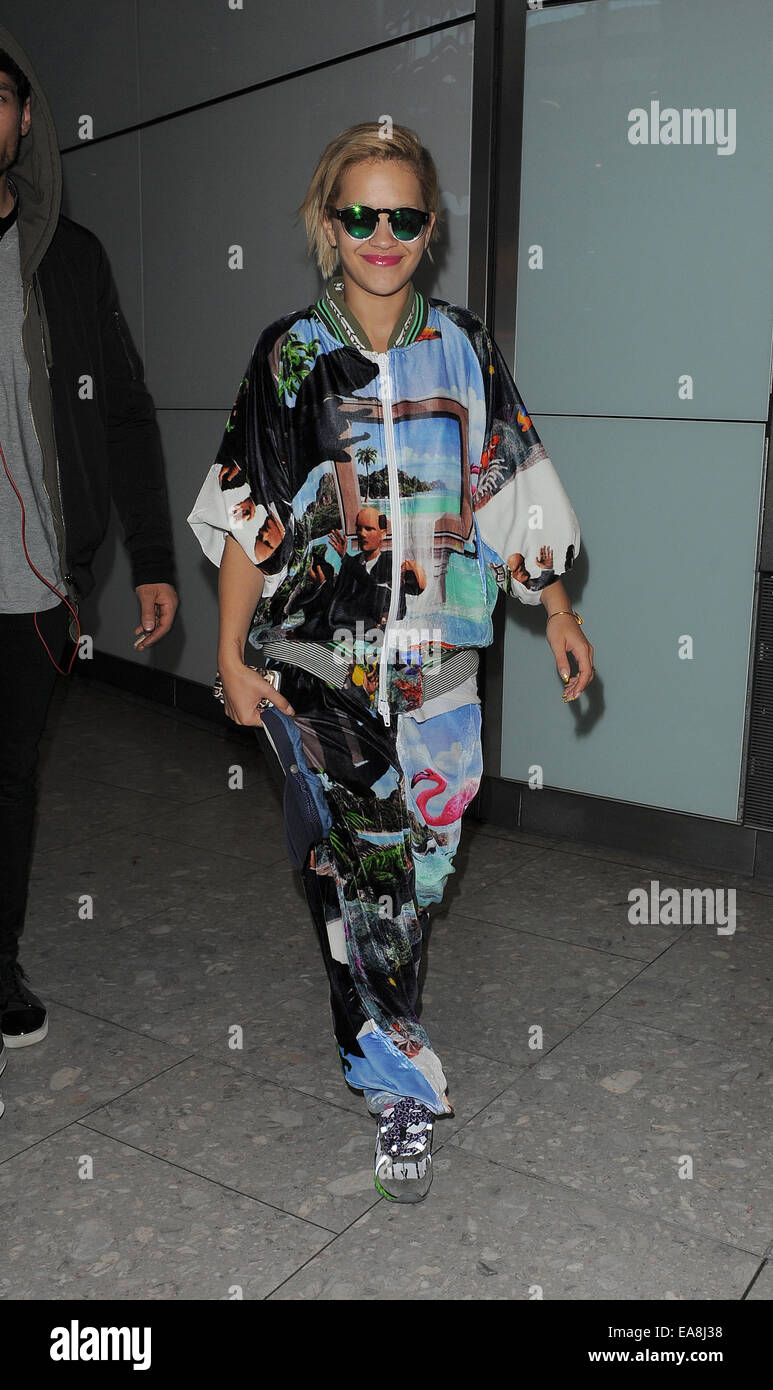 Rita Ora arriving at Heathrow Airport, wearing an outrageous tracksuit