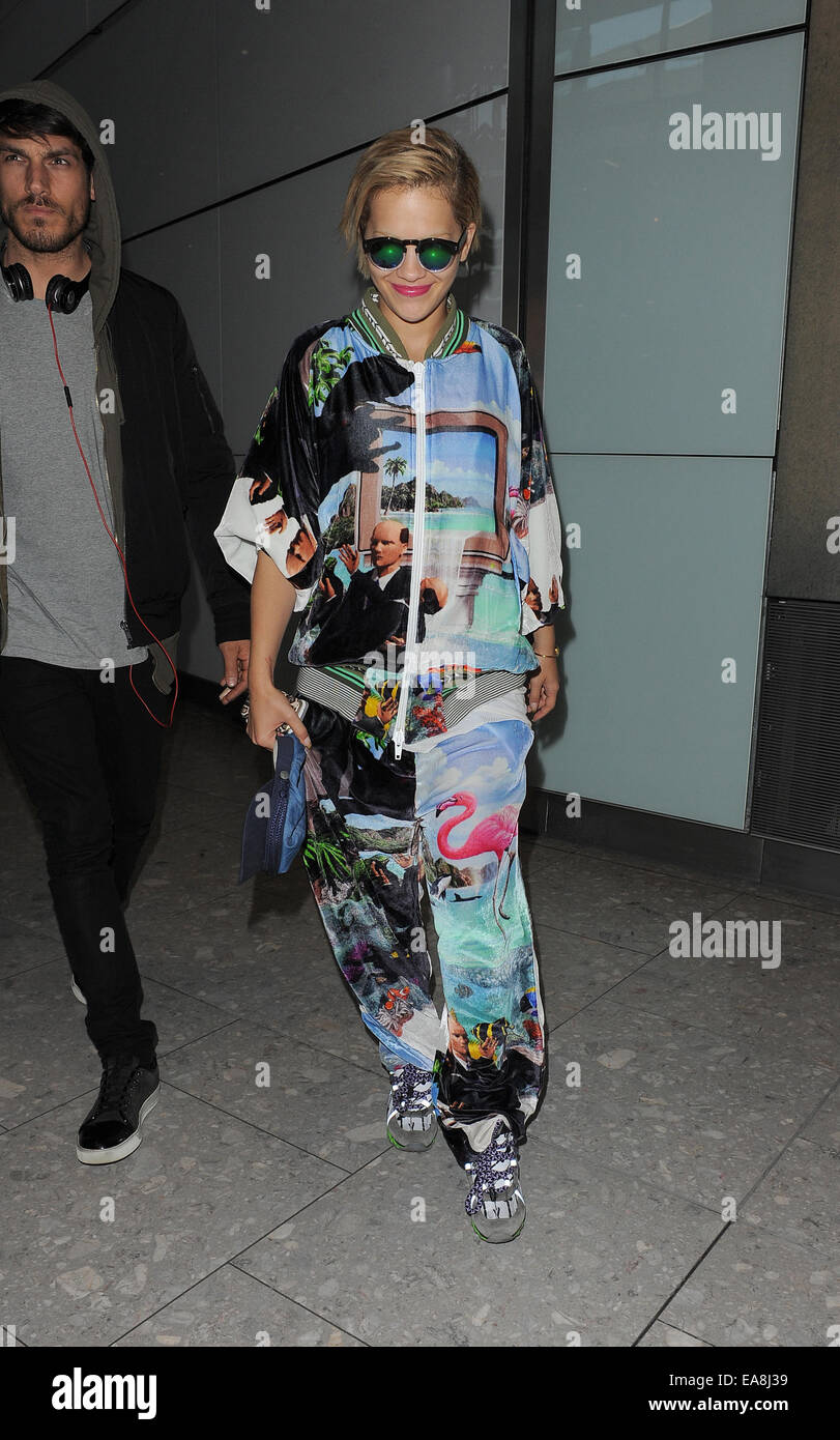 Rita Ora arriving at Heathrow Airport, wearing an outrageous tracksuit