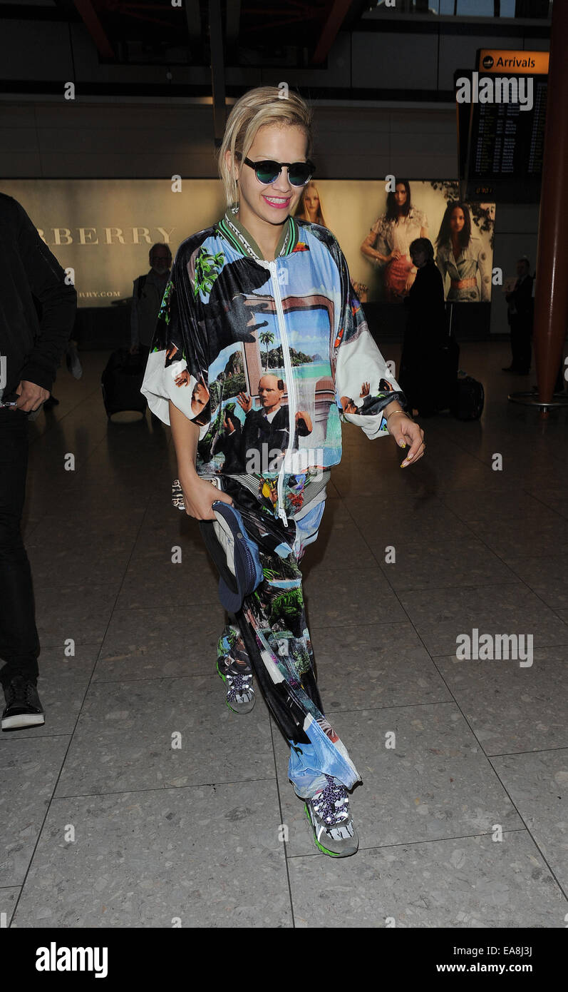 Rita Ora arriving at Heathrow Airport, wearing an outrageous tracksuit