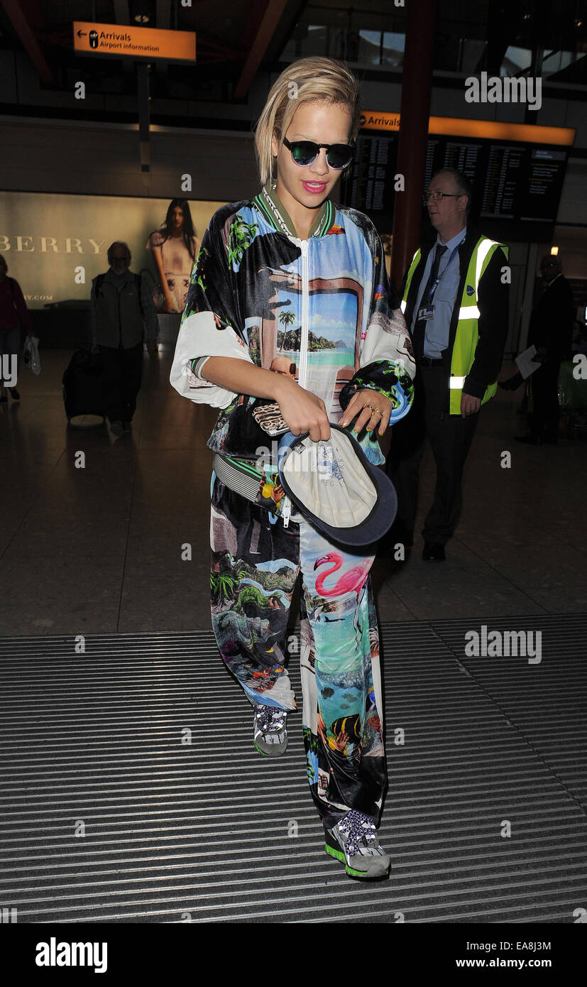 Rita Ora arriving at Heathrow Airport, wearing an outrageous tracksuit